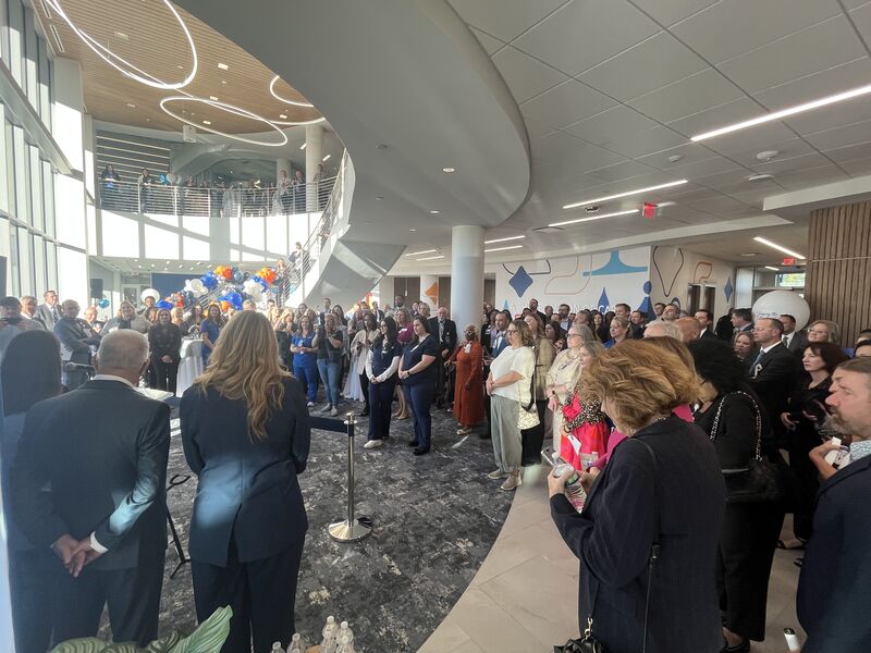 A large crowd celebrates the grand opening of the Aurora campus in September 2025.