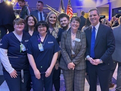 Kentucky Governor Andy Beshear poses with Galen College of Nursing Students.
