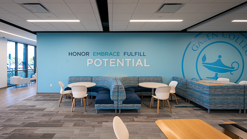 Study room in Galen Miami with inspirational text on the wall: Honor Embrace Fulfill Potential.