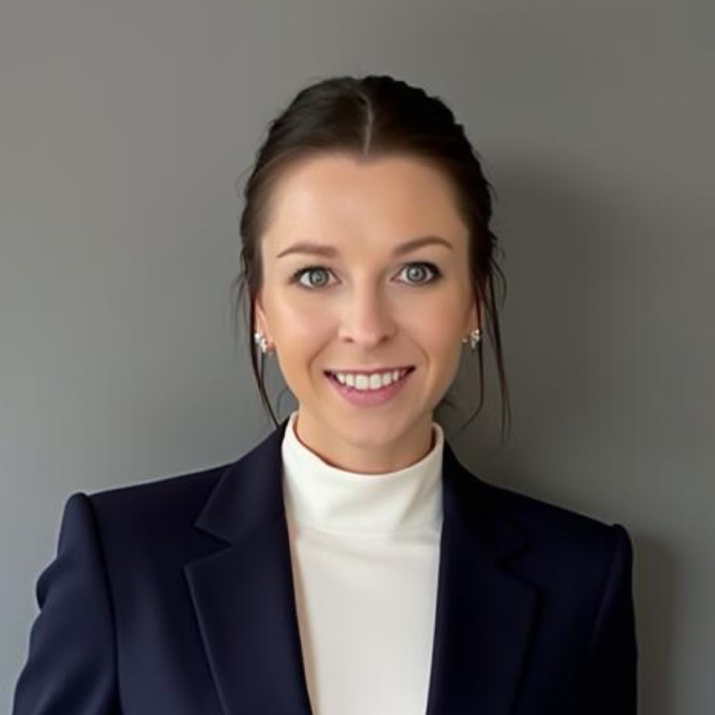 A woman sits for a professional headshot.