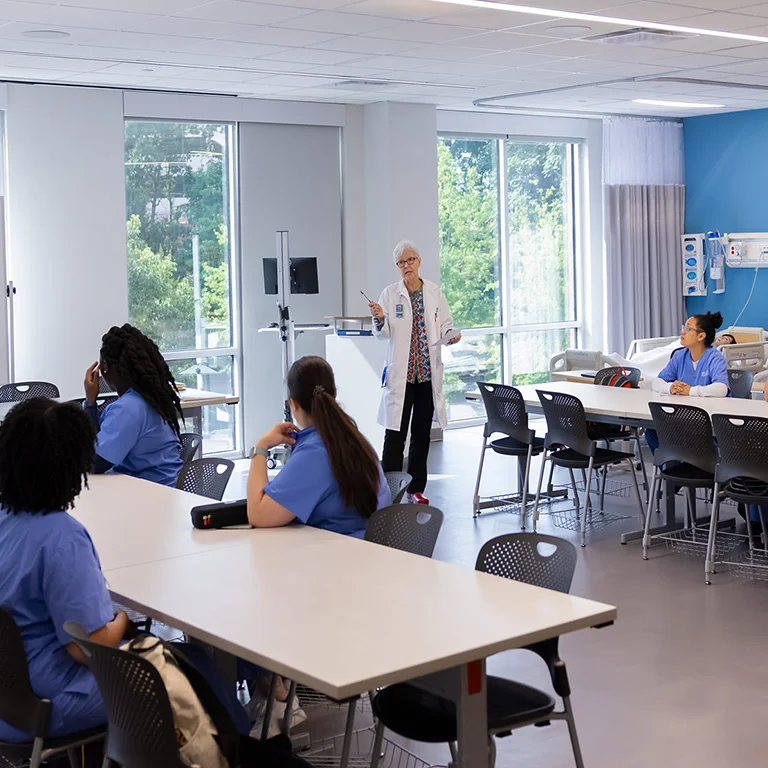 Teacher at Galen College San Antonio with students.