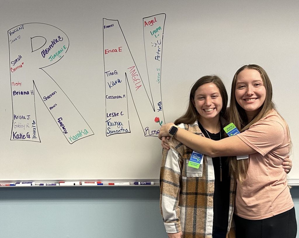 Katie Gamez (right) poses with a classmate.