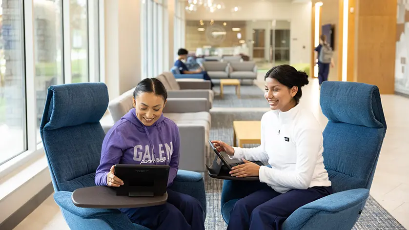 Two students study in a commons area of a Galen campus.